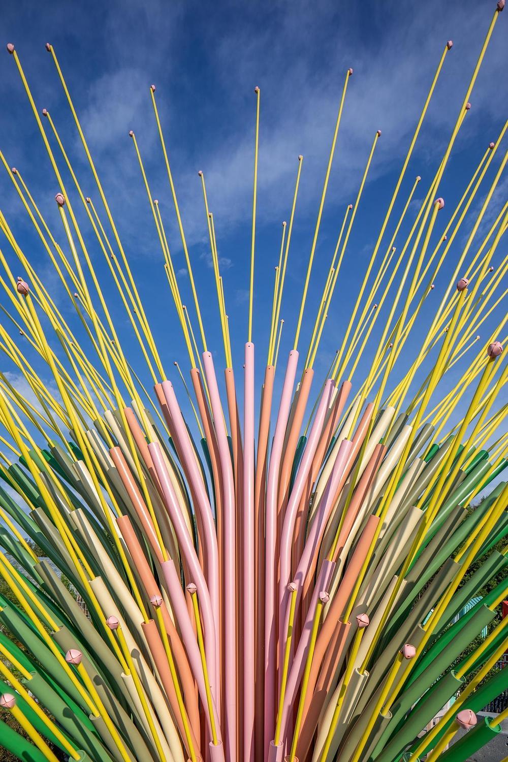 Detail of curved stainless steel tube and flexible rod in Chorus Ventus installation