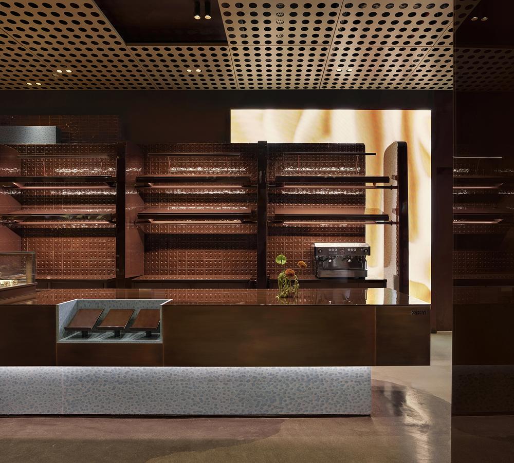 URBANJOBS structures ORIGAMI bakery through a layered spatial system -