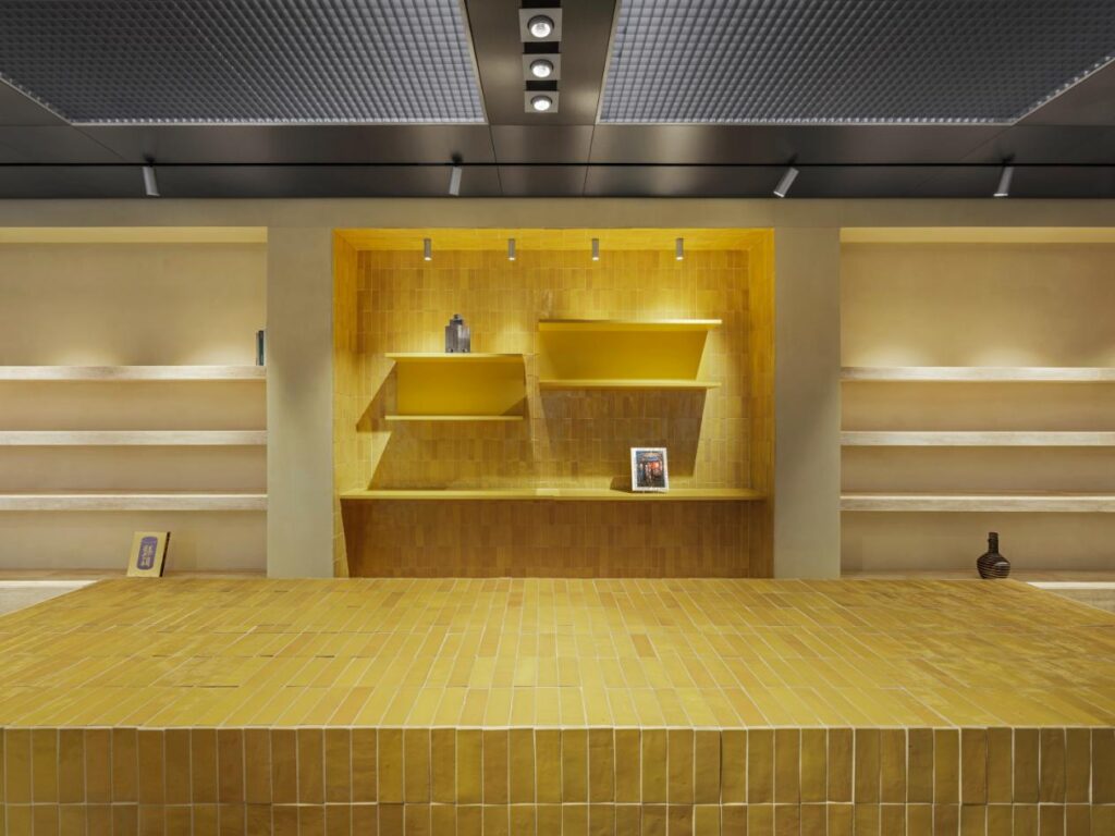 HOFF London flagship store interior showing stainless steel ceiling and integrated lighting