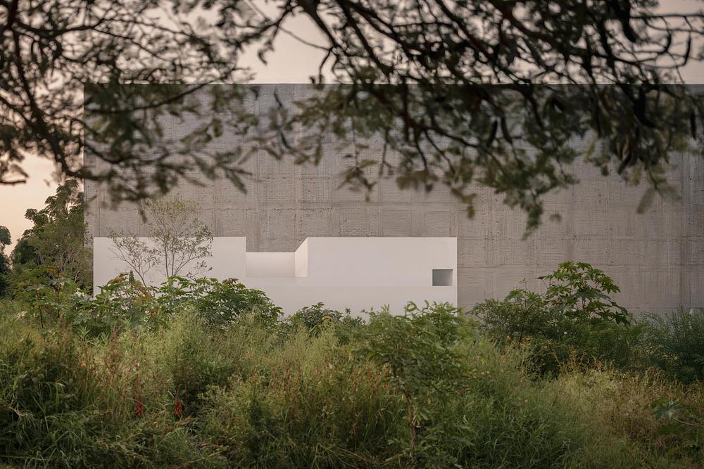 Kehai House by HW Studio built around a stone garden and central void