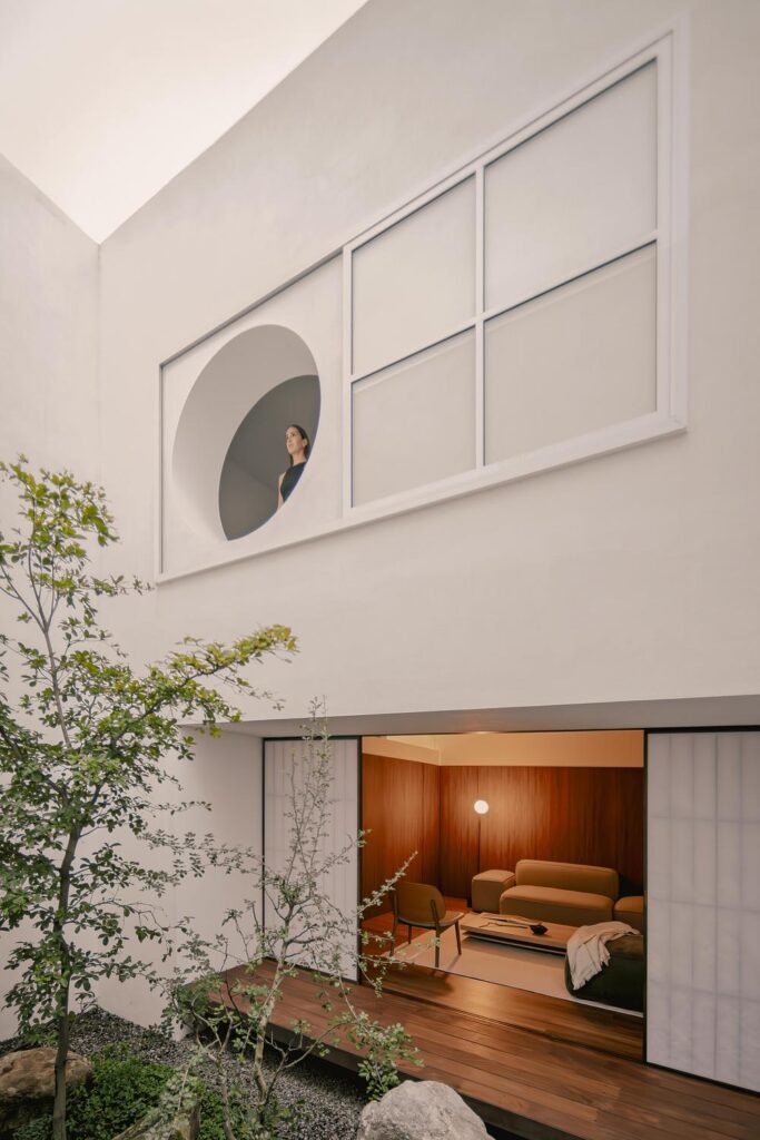 Kehai House by HW Studio built around a stone garden and central void -