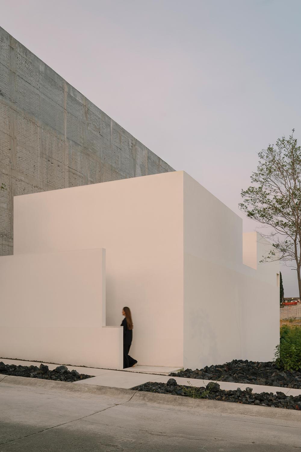 Kehai House by HW Studio built around a stone garden and central void -