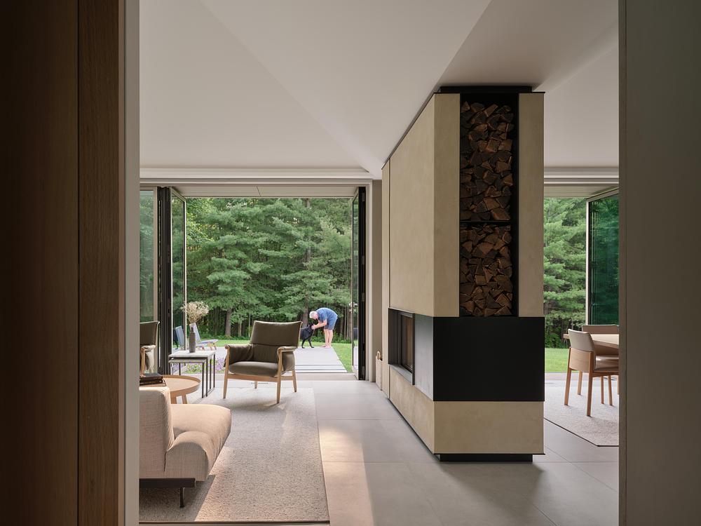 Superkül integrates Ridge House with landscape through sloping roof -
