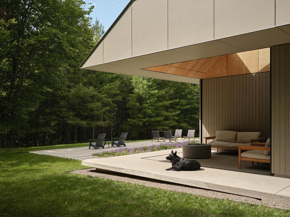 Superkül integrates Ridge House with landscape through sloping roof -