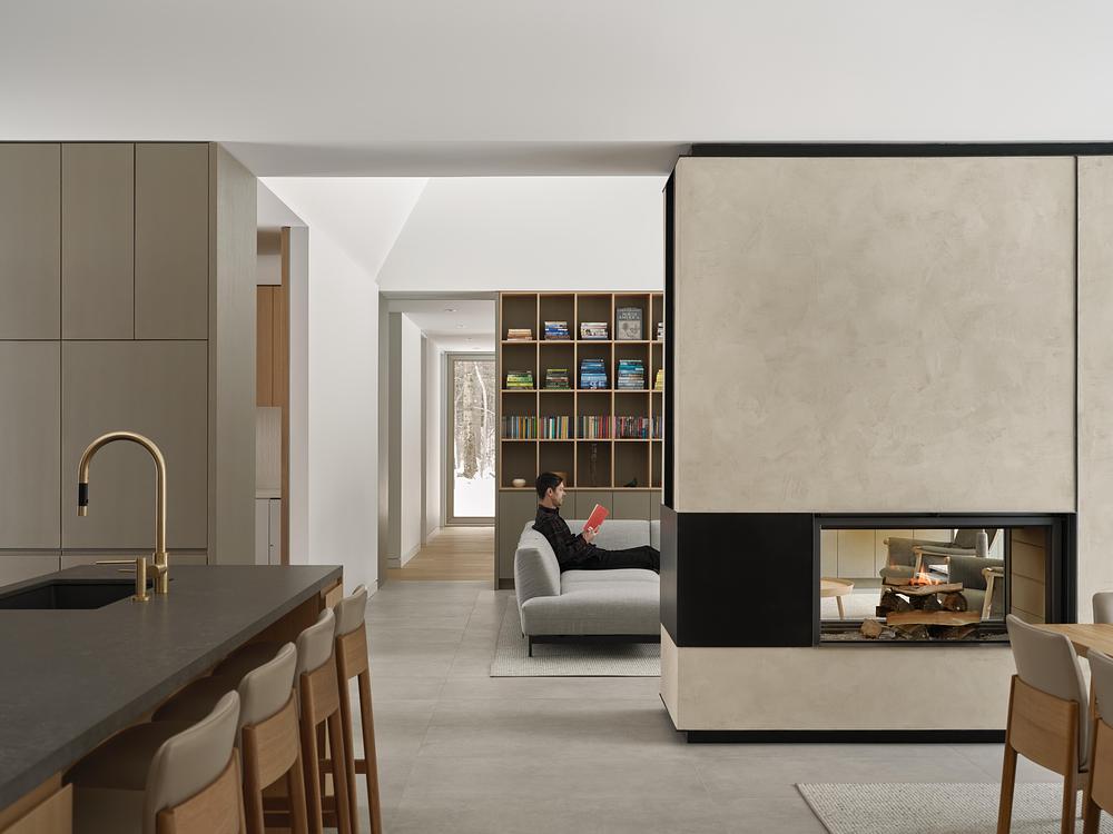 Superkül integrates Ridge House with landscape through sloping roof -