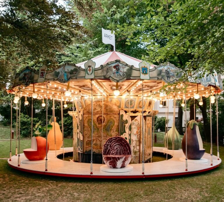Arket and Laila Gohar transform carousel with oversized food sculptures in Milan