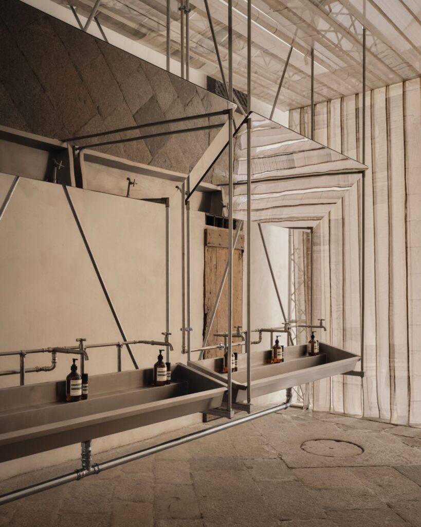 Brass shell shaping process on mechanical lathe in Scorzé workshop
