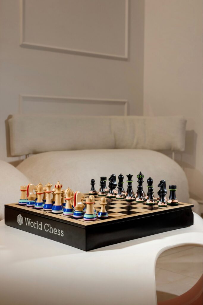 Installation view of collectible chess set presented within design fair exhibition environment