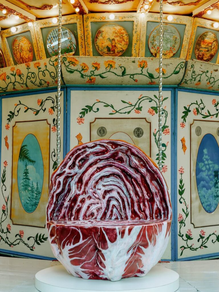 Arket and Laila Gohar transform carousel with oversized food sculptures in Milan -