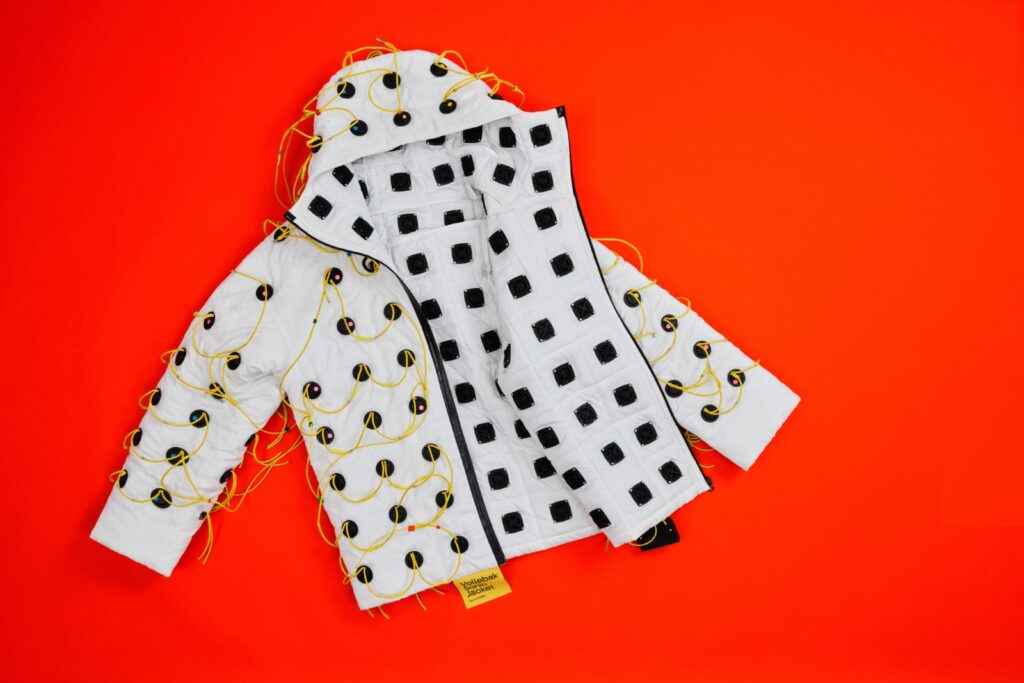 Front view of the jacket showing its speaker-based wearable technology system