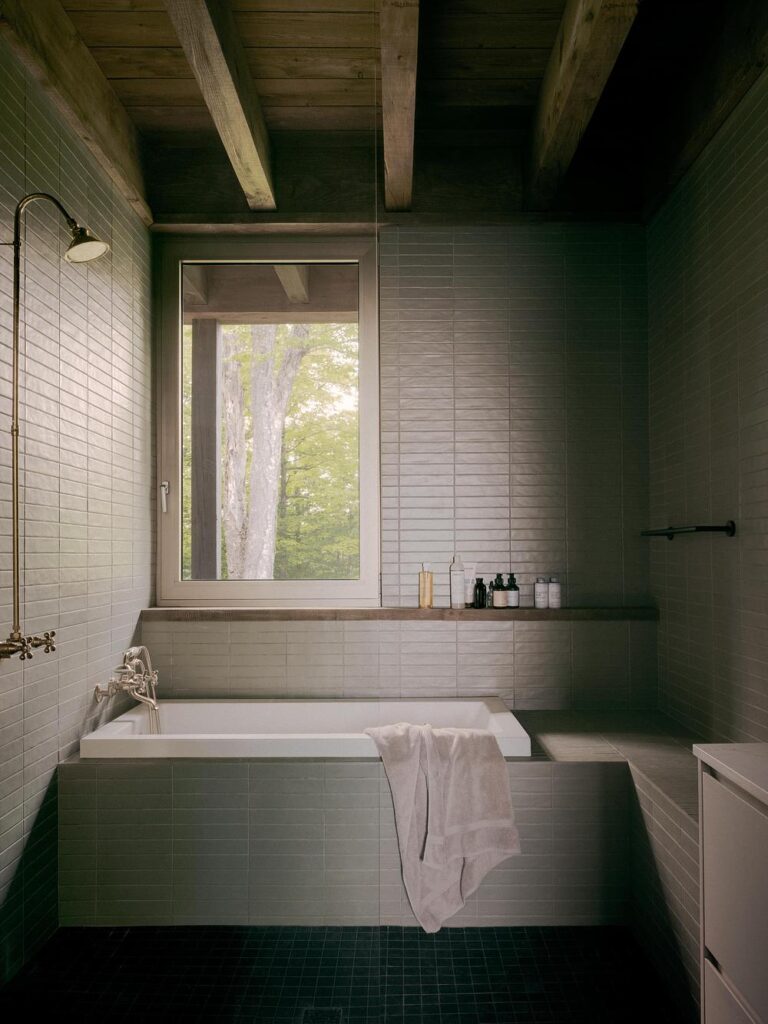 Bathroom with restrained materials and soft daylight