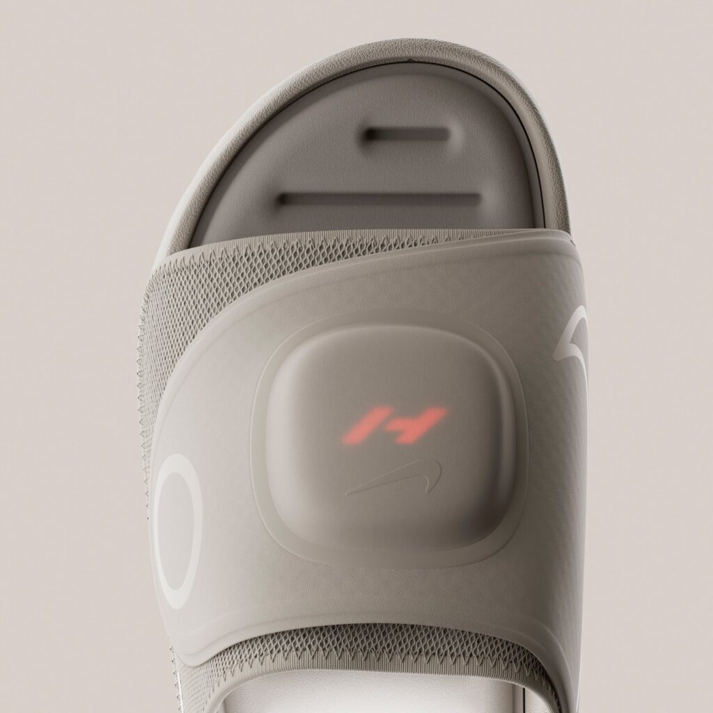 Heated footbed glowing red beneath the adjustable mesh strap
