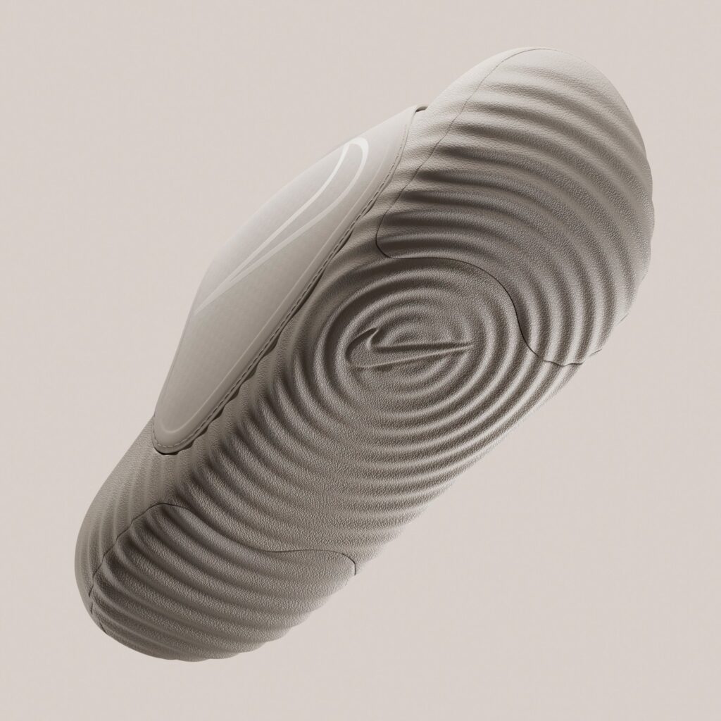 Textured outsole with circular traction pattern and recessed Nike logo