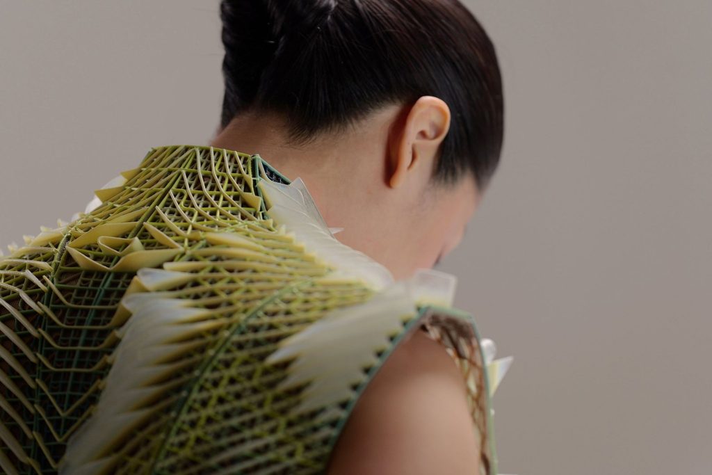 Close-up of the garment’s layered structure around the neck and upper back