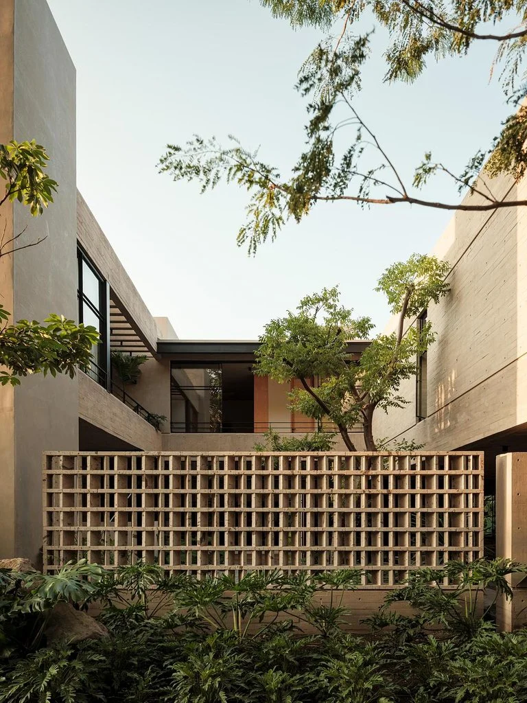 Casa Akina by Di Frenna Arquitectos filters light through concrete 2