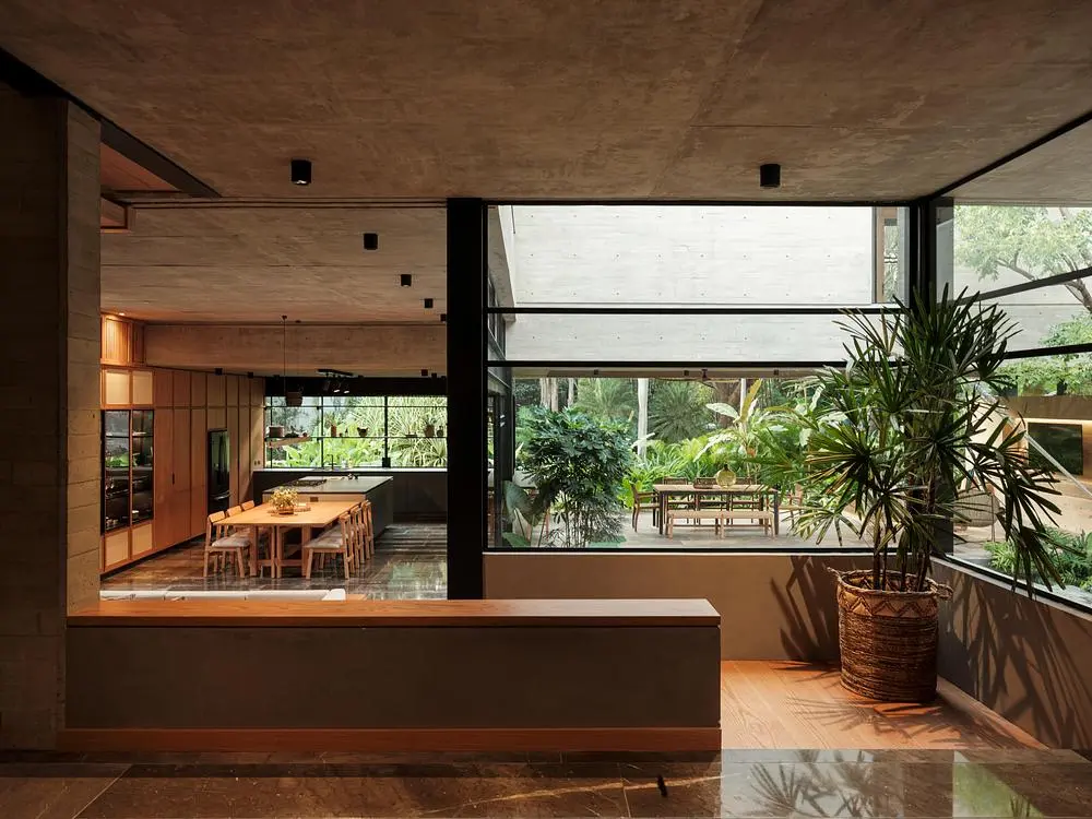 Casa Akina by Di Frenna Arquitectos filters light through concrete 3