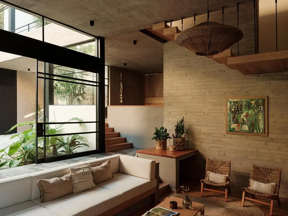 Casa Akina by Di Frenna Arquitectos filters light through concrete 4