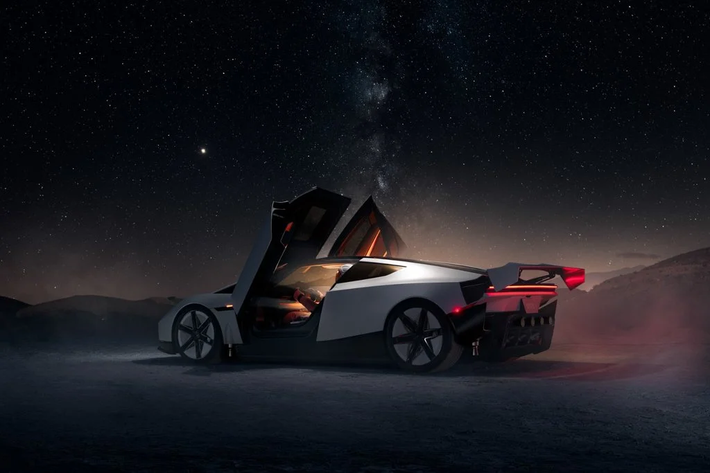 Tesla Roadster with upward-opening doors and illuminated cabin beneath a night sky